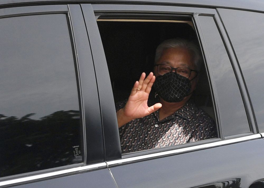 Deputy Prime Minister Datuk Seri Ismail Sabri Yaakob waves at reporters as he leaves Kampung Mengkarak, Bera August 1, 2021. u00e2u20acu201d Bernama pic