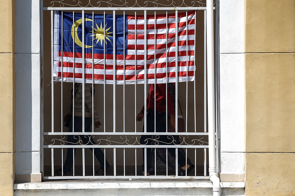 The Jalur Gemilang is seen at a building in George Town August 6, 2021. u00e2u20acu2022 Picture by Sayuti Zainudinn