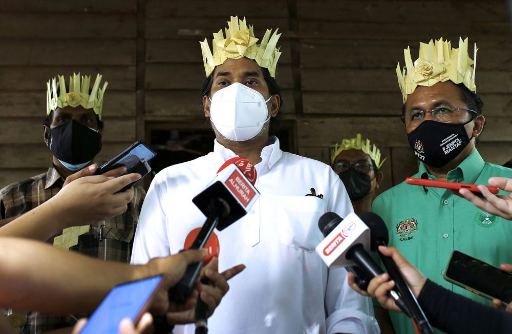 NIP Coordinating Minister Khairy Jamaludin addresses reporters during a visit to the mobile vaccination centre for the Orang Asli community at Kampung Batu Peti, Jempol August 1, 2021. u00e2u20acu201d Bernama pic