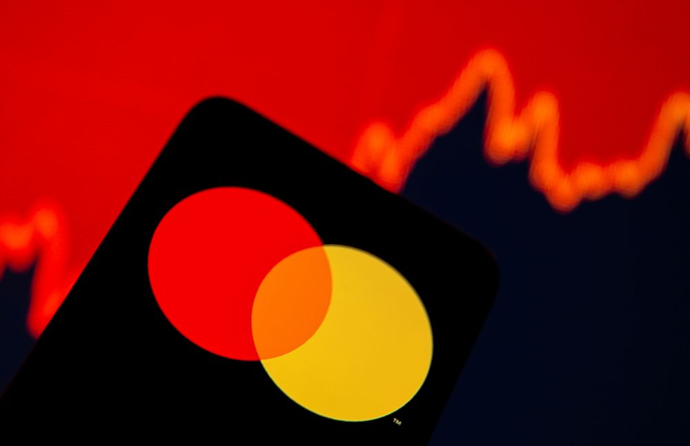 Smartphone with Mastercard logo is seen in front of displayed stock graph in this illustration taken, July 15, 2021. u00e2u20acu201d Reuters pic