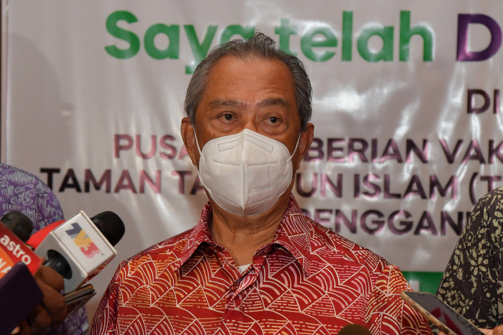 Prime Minister Tan Sri Muhyiddin Yassin speaks to the media after visiting the vaccination centre (PPV) at Taman Tamadun Islam in Kuala Terengganu, August 12, 2021. u00e2u20acu201d Bernama pic 