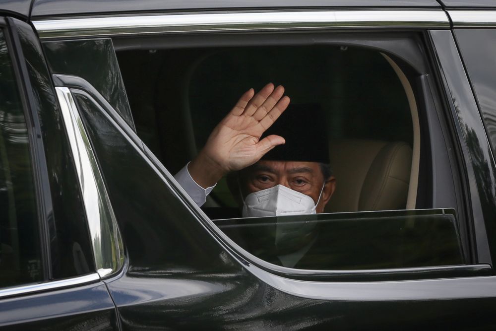 Prime Minister Tan Sri Muhyiddin Yassin waves at members of the media as he arrives at Istana Negara for an audience with the Yang di-Pertuan Agong in Kuala Lumpur August 16, 2021. u00e2u20acu201d Picture by Yusof Mat Isa
