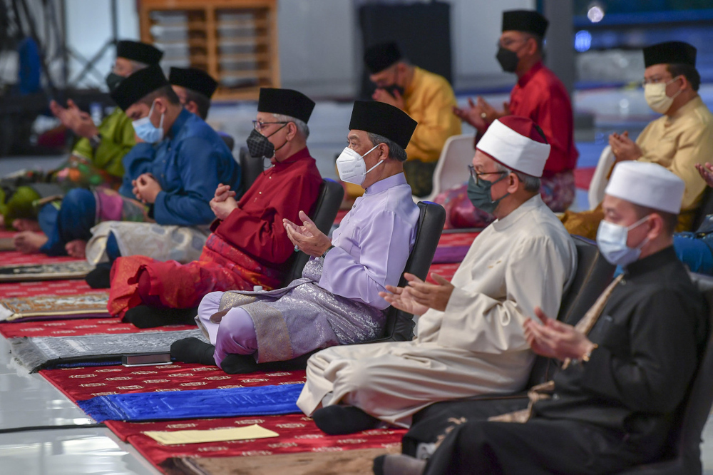 Prime Minister Tan Sri Muhyiddin Yassin, Deputy Prime Minister Datuk Seri Ismail Sabri Yaakob and Minister in the Prime Ministeru00e2u20acu2122s Department (Religious Affairs) Datuk Zulkifli Mohamad recite prayers of the Yearly Hijrah Dua at the 1443H/2021M Maal Hijr