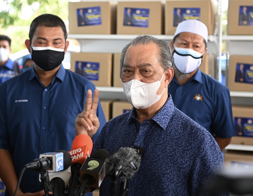 Prime Minister Tan Sri Muhyiddin Yassin speaks to reporters at the Sungai Raya district office in Muar August 6, 2021. u00e2u20acu2022 Bernama pic