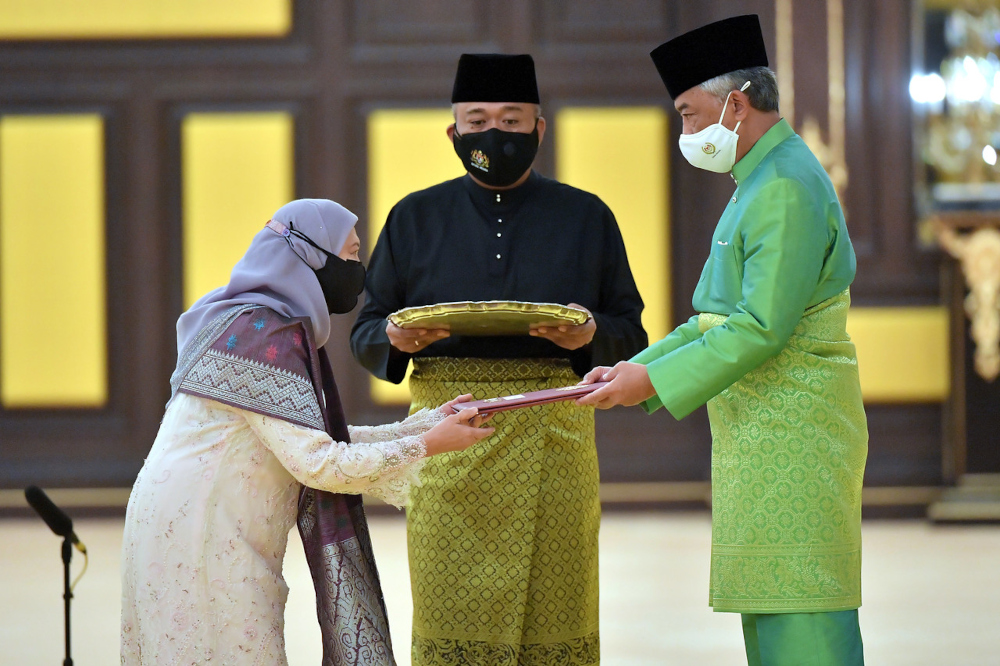 The Yang di-Pertuan Agong presents the appointment letter to Tourism, Arts and Culture Minister Datuk Seri Nancy Shukri at Istana Negara, August 30, 2021. u00e2u20acu201d Bernama pic 