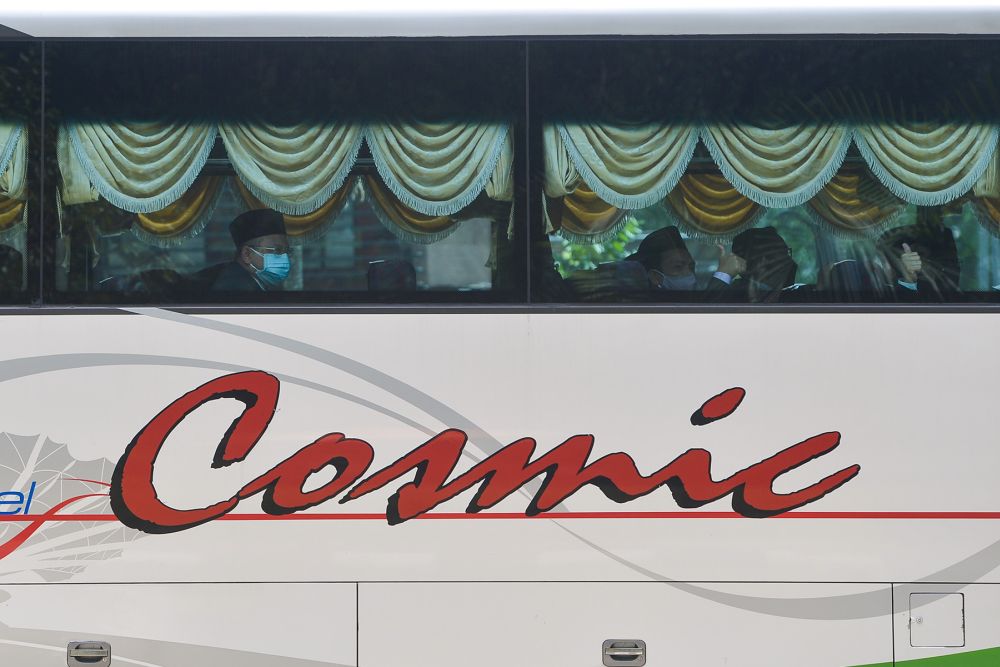 A bus ferrying PAS MPs arrives at Istana Negara in Kuala Lumpur on August 19, 2021. — Picture by Miera Zulyana
