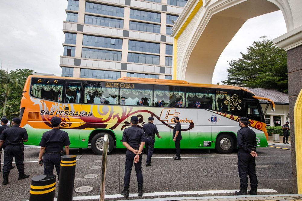 A bus ferrying Perikatan Nasional MPs arrives at Istana Negara in Kuala Lumpur on August 19, 2021. — Picture by Firdaus Latif