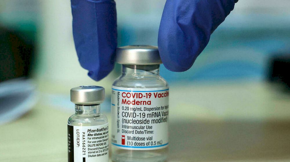 A medic places two vials of Covid-19 coronavirus vaccines on a table before administering doses at a Clalit Health Services Medical Centre in east Jerusalem on August 10, 2021. u00e2u20acu201d AFP pic