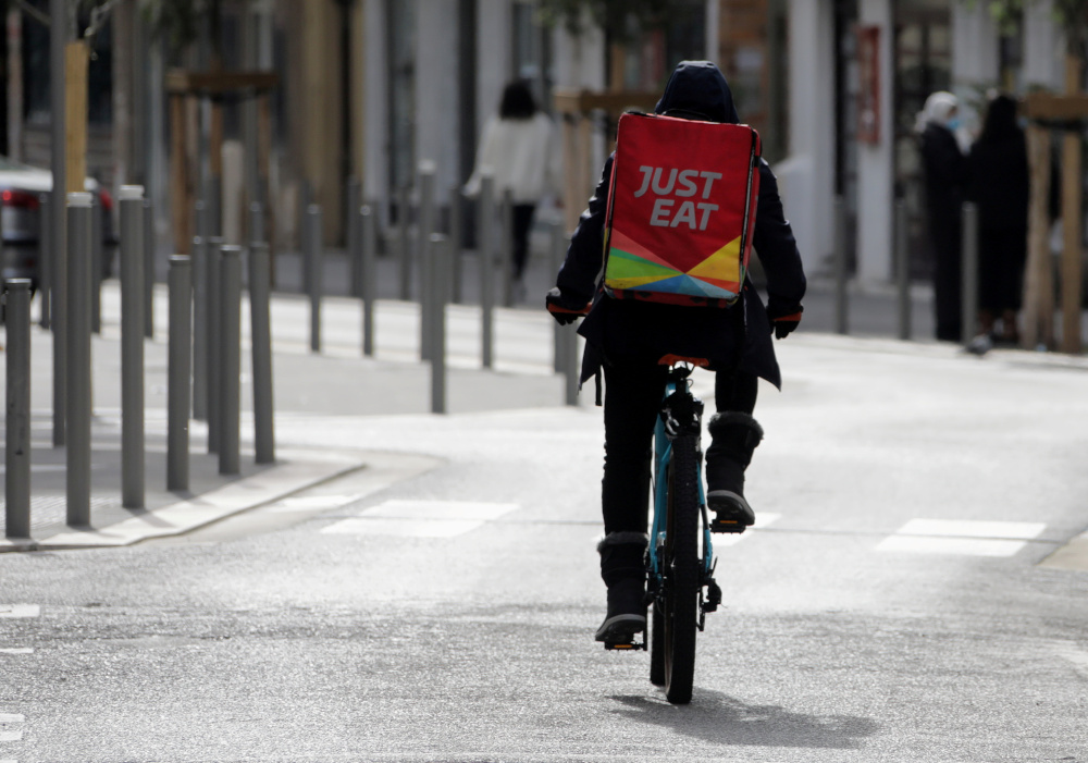 A Just Eat delivery man rides his bicycle in Nice amid the coronavirus disease (Covid-19) outbreak in France, February 16, 2021. u00e2u20acu201d Reuters pic