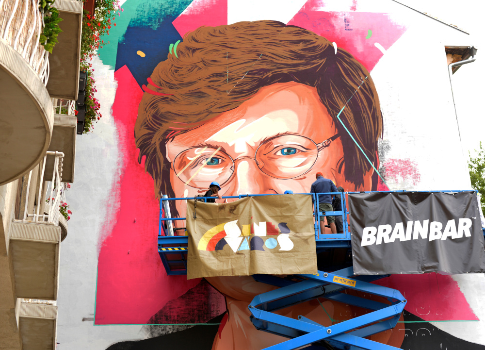 A painter makes finishing touches on a mural showing a portrait of Katalin Kariko, a Hungarian-born scientist and senior vice president at BioNTech, who laid the groundwork for the mRNA Covid-19 vaccines in Budapest August 28, 2021. u00e2u20acu201d Reuters pic