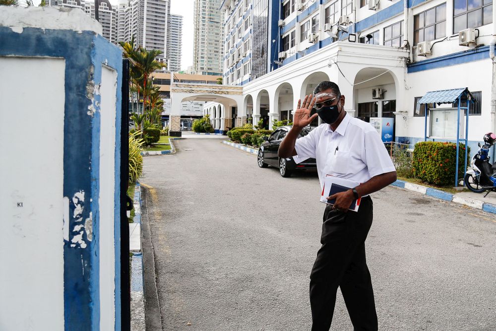 Jelutong MP RSN Rayer greets members of the media at the Northeast district police station in George Town August 10, 2021. u00e2u20acu2022 Picture by Sayuti Zainudin