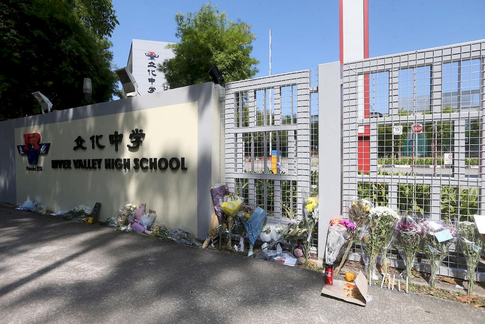 Bouquets of flowers left at the main gate of River Valley High School on July 25, 2021. u00e2u20acu201d TODAY pic
