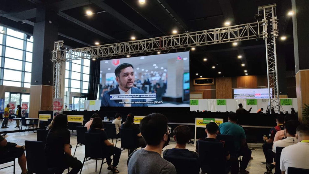 Those with appointments on MySejahtera and walk-ins and foreigners are in separate halls