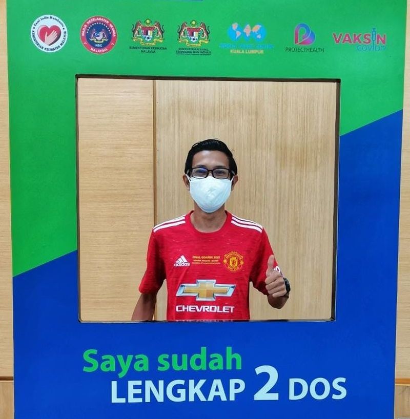 Government servant Aizat Ikhwan, who got his second Covid shot on July 22, said that while Malaysians rebelled at the idea of staying home, it’s best to stay put for now. — Picture courtesy of Aizat Ikhwan