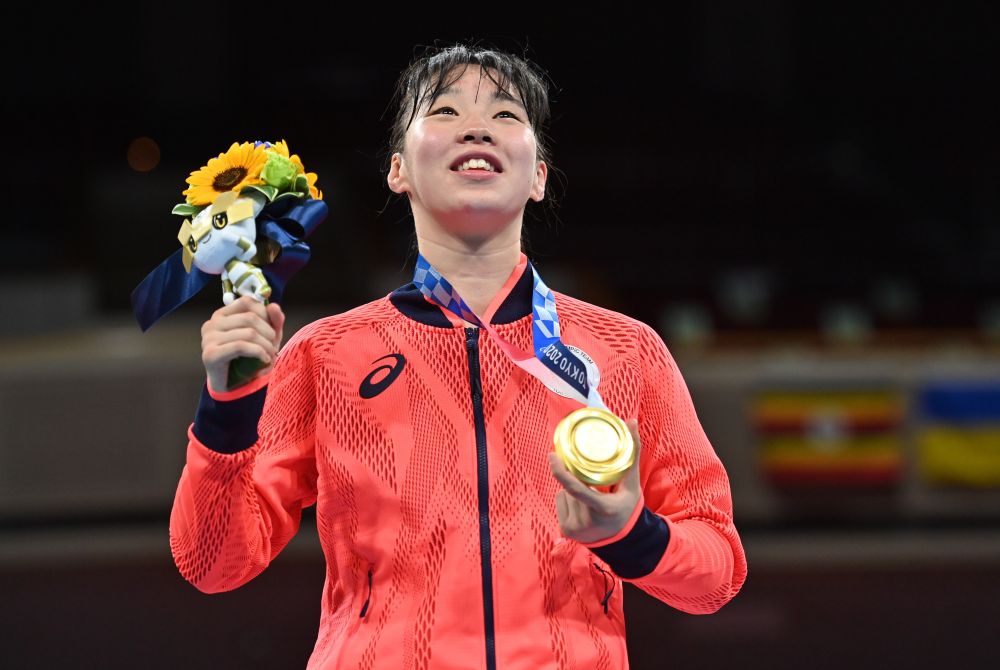 Boxer Sena Irie of Japan poses with her gold medal after winning the women's featherweight category at the Kokugikan Arena, Tokyo August 3, 2021. u00e2u20acu2022 Reuters picnn