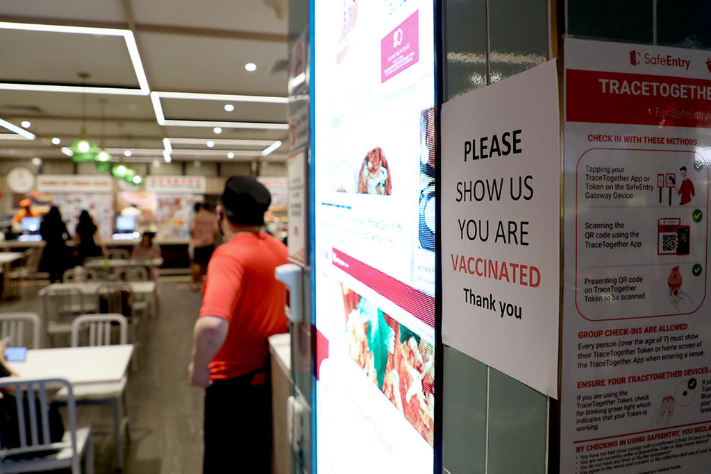 A notice outside a restaurant in Ion Orchard mall asking diners to show their vaccination status. u00e2u20acu2022 TODAY pic