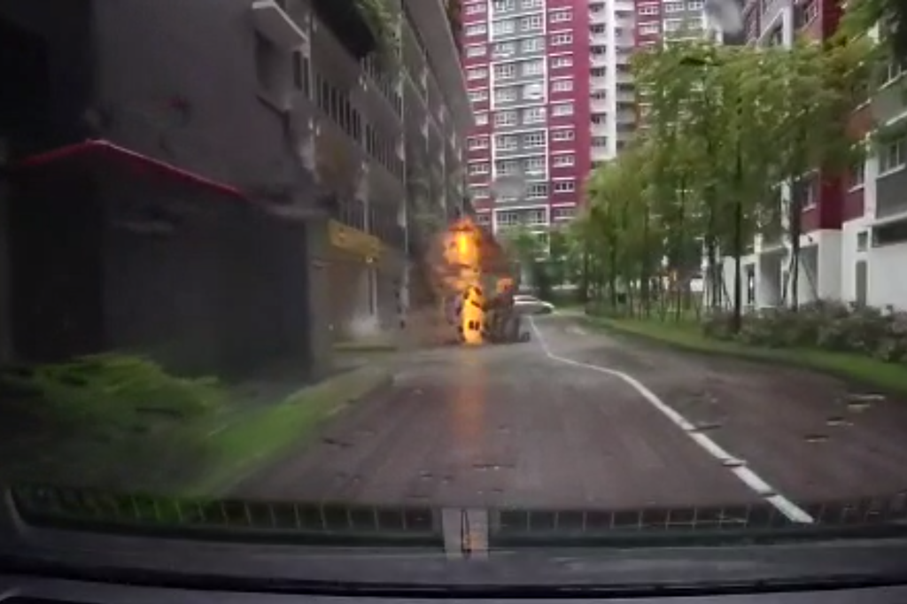 A manhole blows up outside a multi-storey car park at Bukit Batok West. This screengrab was taken from a dashcam video circulating on social media. u00e2u20acu2022 Picture via social media