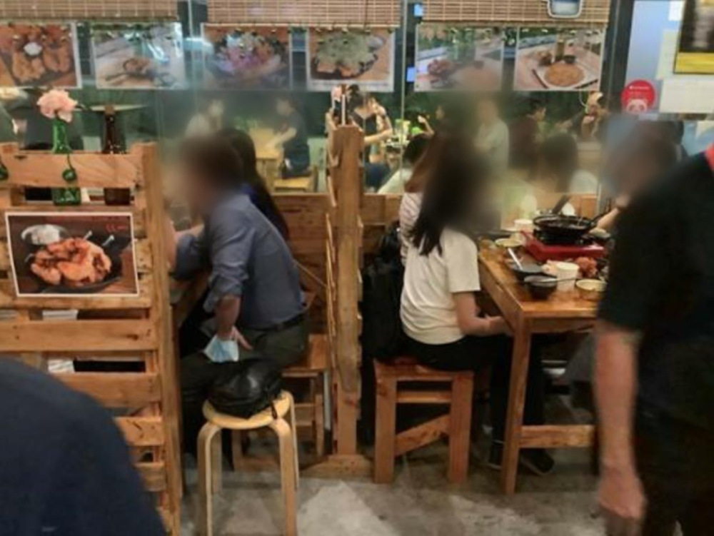 Ahtti, an eatery in Jurong East, failed to ensure safe distancing of at least 1m between groups of customers on many occasions. u00e2u20acu201d Picture by Singapore Food Agency