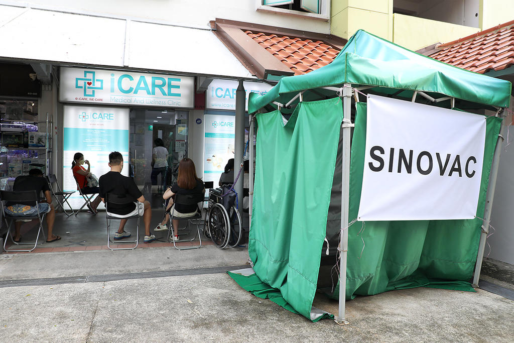 People waiting to get the Sinovac Covid-19 vaccine at iCare Medical and Wellness Clinic on June 18, 2021. u00e2u20acu201d TODAY pic