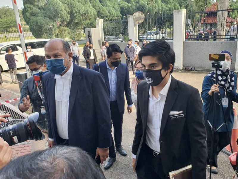 Muar MP Syed Saddiq Syed Abdul Rahman (right) and lawyer Gobind Singh Deo arrive at the Sessions Court in Johor Baru August 5, 2021. u00e2u20acu201d Picture by Ben Tan