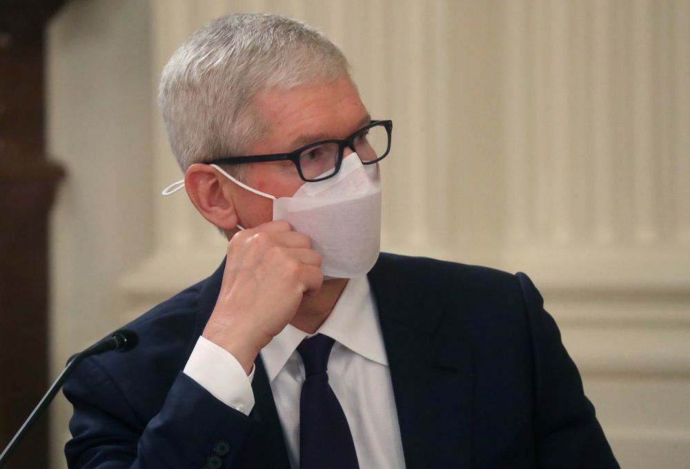 Apple Inc Chief Executive Officer Tim Cook listens as US President Joe Biden delivers remarks during a meeting with private sector leaders on how to improve the nation's cybersecurity at the White House in Washington August 25, 2021. u00e2u20acu201d Reuters picnn