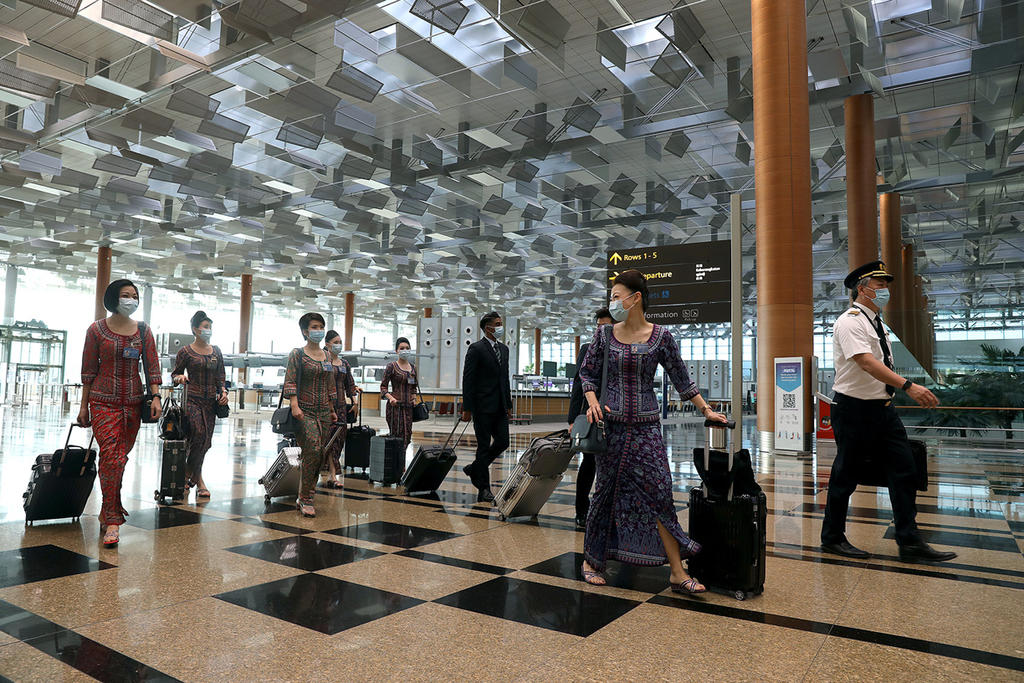 SIA said that all of the groupu00e2u20acu2122s front-line ground workers based in Singapore have been vaccinated against Covid-19, while some 99 per cent of its active pilots and cabin crew members have also received their shots. u00e2u20acu2022 TODAY pic