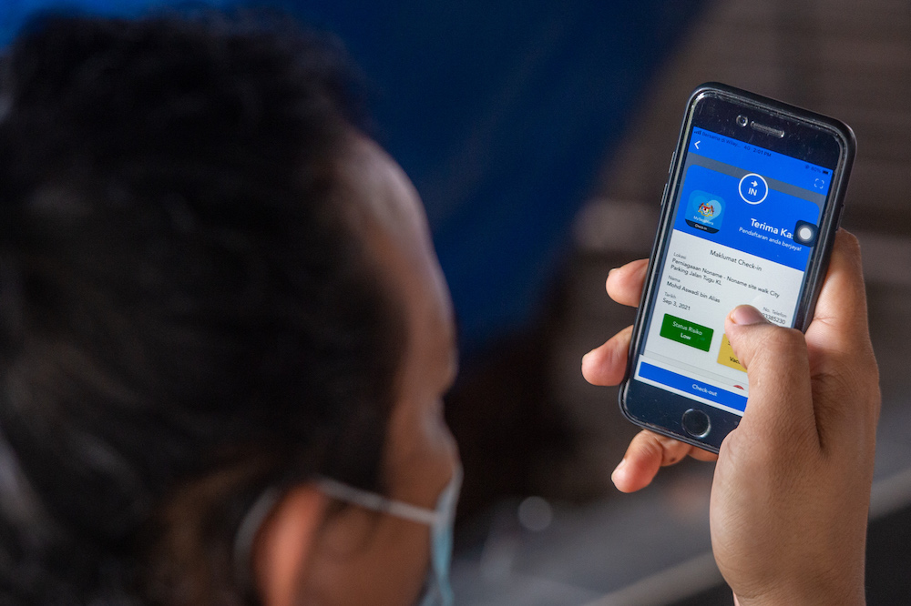 The MySejahtera app has been updated to make it easier for people to display their risk level and vaccination status. u00e2u20acu201d Picture by Shafwan Zaidon