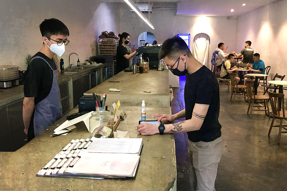 Barista Darren Lee (third from left) checking orders at Sunday Coffee & Cakes in Taman Bukit Indah, OUG.
