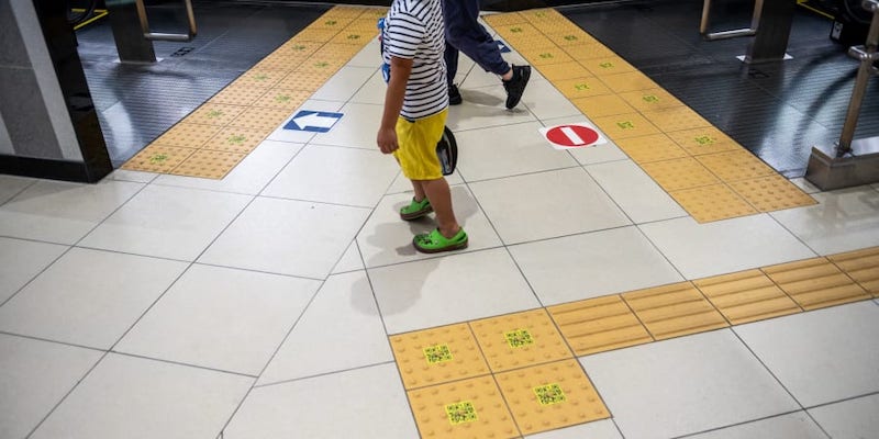 The yellow sidewalk panels, also known as tenji blocks, which are aimed to help people with visual impairments, are seen inside a train station in Tokyo. u00e2u20acu201d AFP pic     
