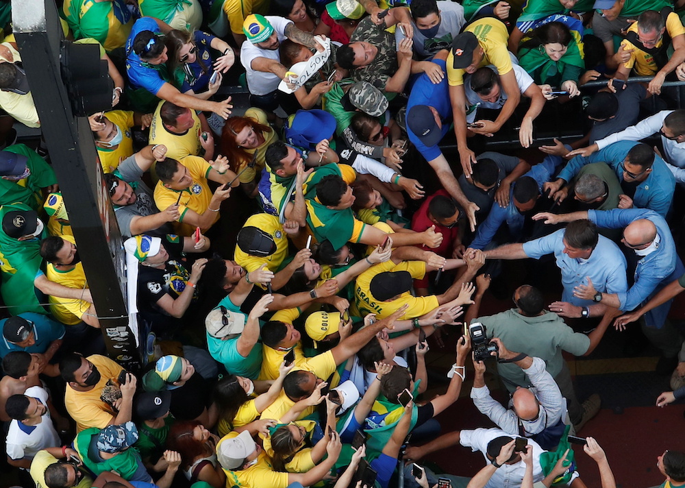 Brazilian President Jair Bolsonaro greets his supporters as they gather to back the far-right leader in his dispute with the Supreme Court, in Sao Paulo, Brazil September 7, 2021. u00e2u20acu201d Reuters pic