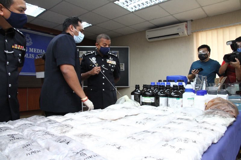 Johor police chief Datuk Ayob Khan Mydin Pitchay with the drugs seized after a series of raids in Johor Baru and Iskandar Puteri districts yesterday, September 17, 2021 u00e2u20acu201d Picture by Ben Tan
