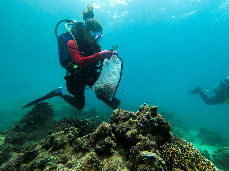 Diving instructor Carmela Sevilla holds a mesh bag filled with trash during an underwater cleanup drive in Bauan, Batangas Province, Philippines September 18, 2021. u00e2u20acu201d Reuters pic