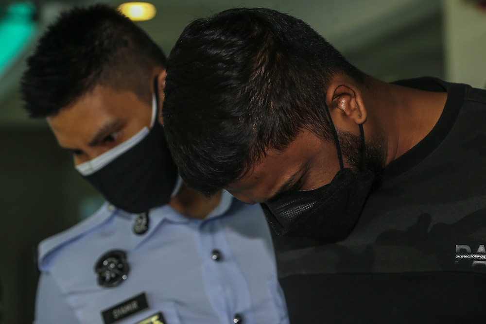 Devaaswin Krishnan arrives at the Shah Alam High Court to be charged with the murder of two youths following a fatal accident along Federal Highway on September 12. u00e2u20acu201d Picture by Yusof Mat Isa 