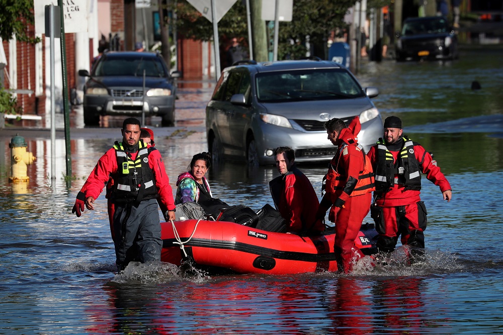 First responders pull local residents in a boat as they perform rescues of people trapped by floodwaters in Mamaroneck, New York September 2, 2021. u00e2u20acu201d Reuters pic