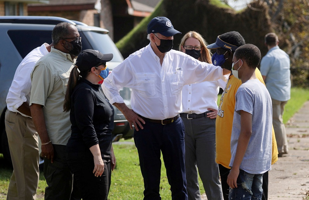US President Joe Biden talks to residents as he tours a neighbourhood hit by Hurricane Ida in LaPlace, Louisiana September 3, 2021. u00e2u20acu201d Reuters pic