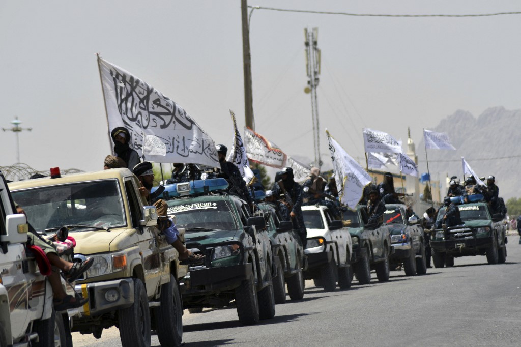 Taliban fighters atop vehicles with Taliban flags parade along a road to celebrate after the US pulled all its troops out of Afghanistan, in Kandahar on September 1, 2021 following the Talibanu00e2u20acu2122s military takeover of the country. u00e2u20acu201d AFP picn n