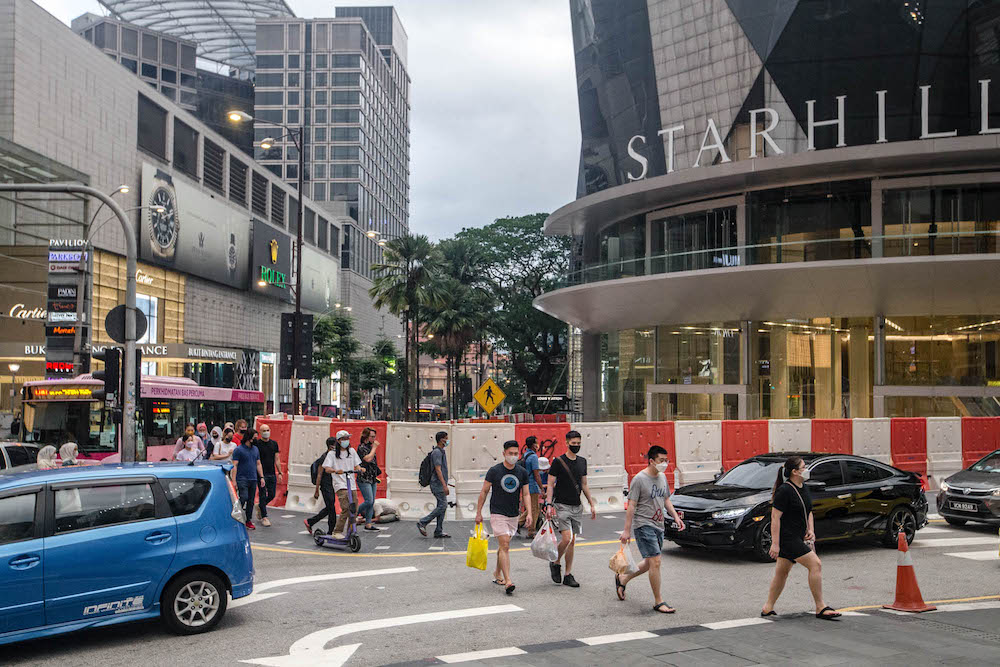 People are seen wearing protective masks as they walk along the Bukit Bintang shopping area during Phase One of the National Recovery Plan in Kuala Lumpur on September 4, 2021. u00e2u20acu201d Picture by Firdaus Latifnn