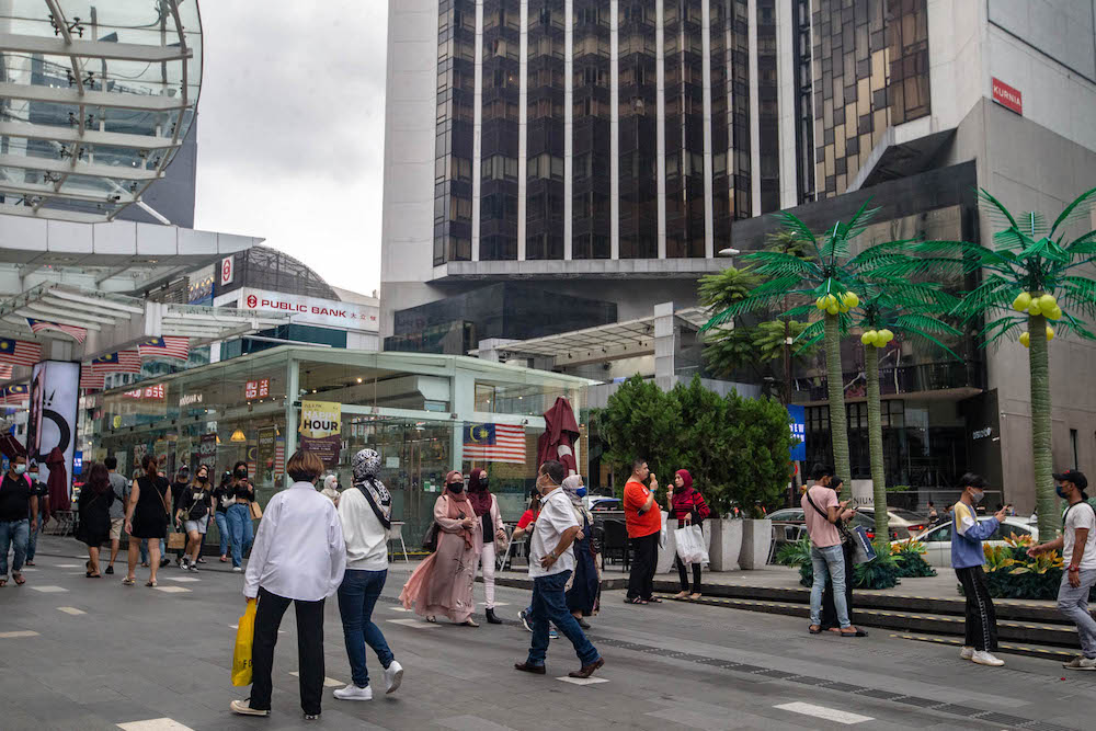 People are seen wearing protective masks as they walk along the Bukit Bintang shopping area during Phase One of the National Recovery Plan in Kuala Lumpur on September 4, 2021. u00e2u20acu201d Picture by Firdaus Latifnn