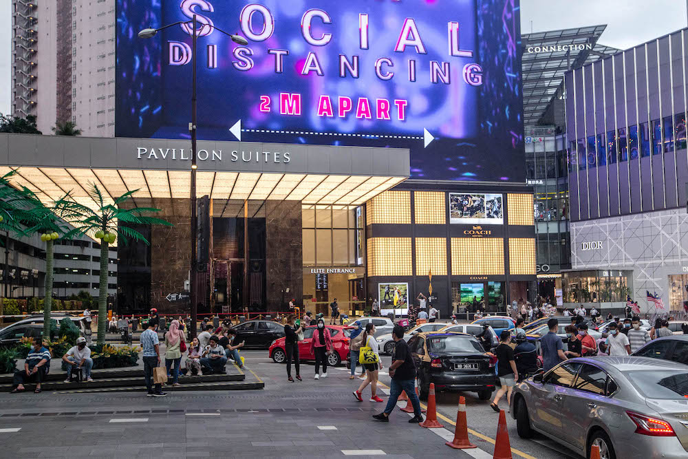 People are seen wearing protective masks as they walk along the Bukit Bintang shopping area during Phase One of the National Recovery Plan in Kuala Lumpur on September 4, 2021. u00e2u20acu201d Picture by Firdaus Latifnn