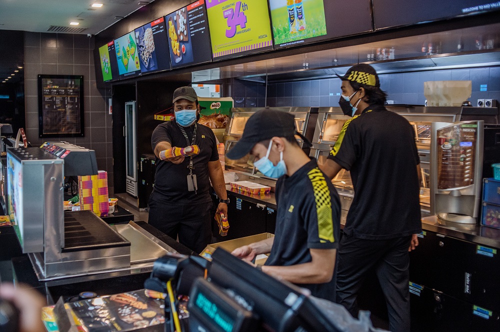 GSC Cinema staff prepare for reopening at the Mid Valley Megamall outlet in Kuala Lumpur September 8, 2021. — Picture by Shafwan Zaidon