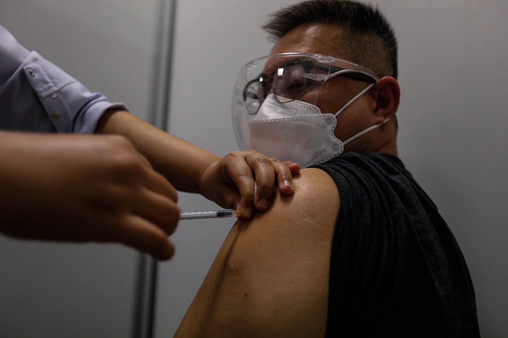 A man receives his Covid-19 vaccine jab at the Vaccine Administration Centre in Sungai Nibong Expo Site Sept 8, 2021. u00e2u20acu2022 Picture by Sayuti Zainudin
