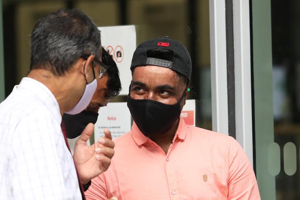 Mehedi, a worker who survived a deadly blast at Tuas industrial unit, leaving the State Courts building on Sept 21, 2021 after giving evidence to a committee of inquiry into the incident. u00e2u20acu201d TODAY picn