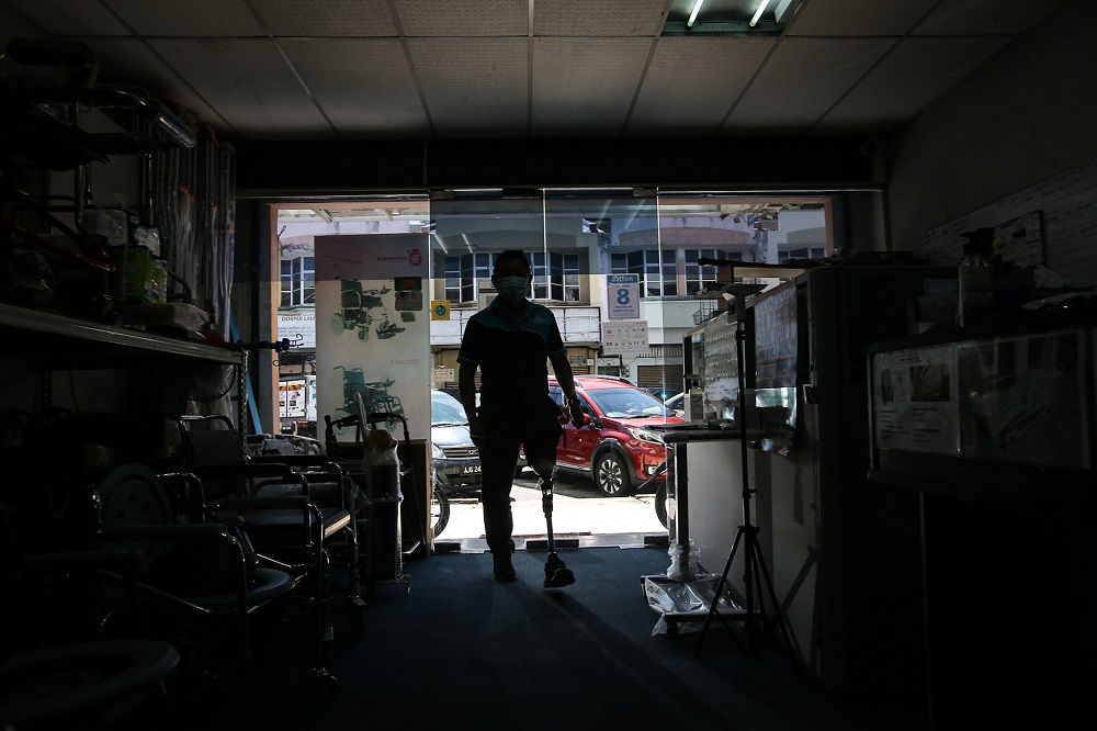 Ho is the proud owner of his own business which is in the process of expanding. u00e2u20acu201d Picture by Farhan Najib