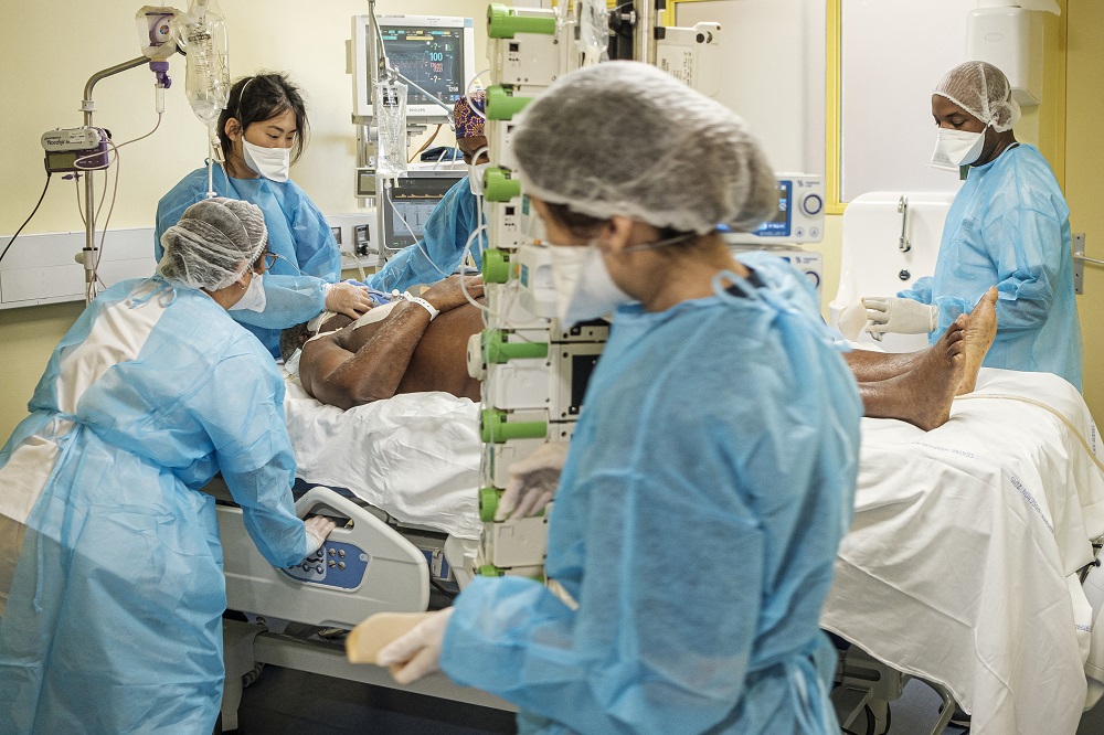 Health workers take care of a man in a coma at an intensive care unit set up for those infected with the novel coronavirus, Covid-19. u00e2u20acu201d AFP pic