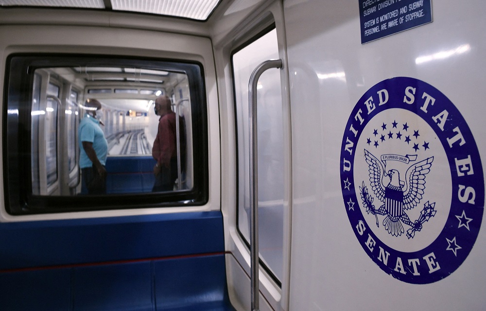 Capitol Hill staffers are seen on a subway car at the US Capitol. u00e2u20acu201d AFP pic