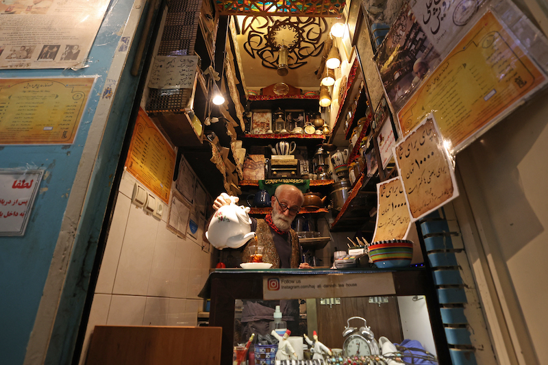 Owner Kazem Mabhutian, 63, serves tea at the smallest and oldest teahouse tucked away in an alleyway of the Grand Bazaar in the Iranian capital Tehran September 20, 2021. u00e2u20acu201d AFP pic