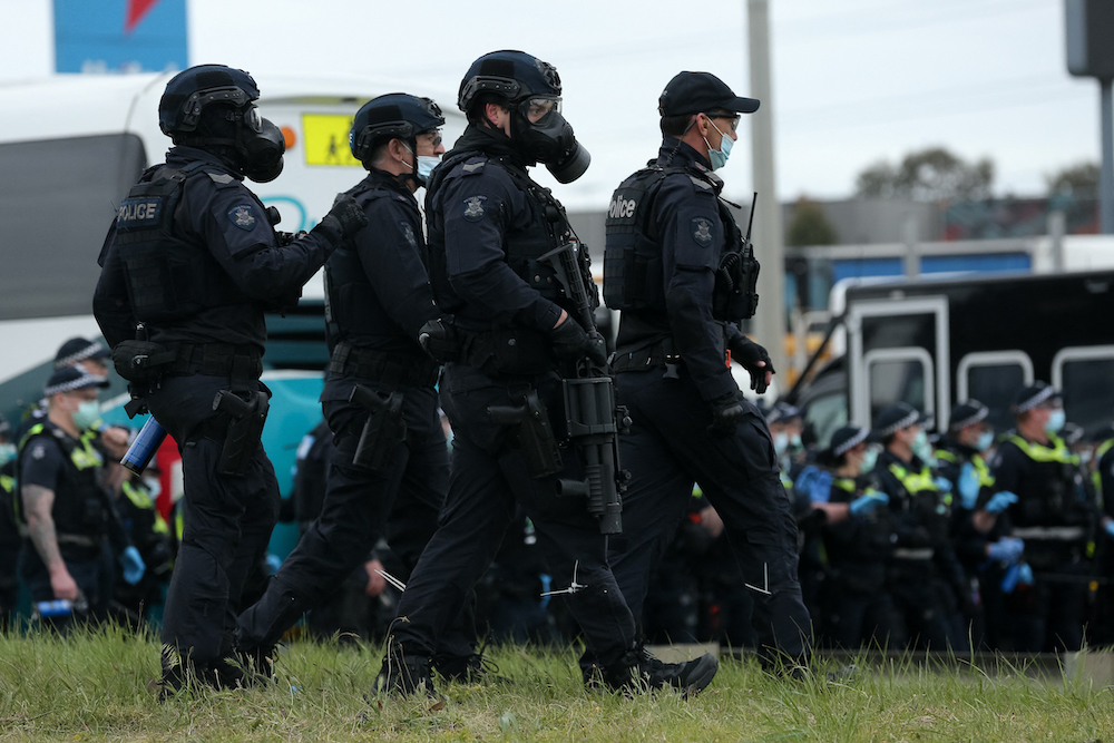 Police officers patrol during a protest against Covid-19 regulations in Melbourne September 21, 2021. u00e2u20acu201d AFP pic