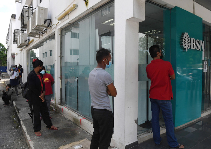 People in Kuantan queue up for the Bantuan Prihatin Rakyat payments at Bank Simpanan Nasional (BSN) in Kuantan July 1, 2021. u00e2u20acu201d Bernama pic 