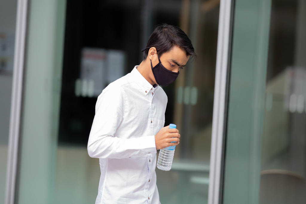 Stars Engrg engineer Lwin Moe Tun leaving the State Courts building on Sept 29, 2021. u00e2u20acu201d TODAY pic