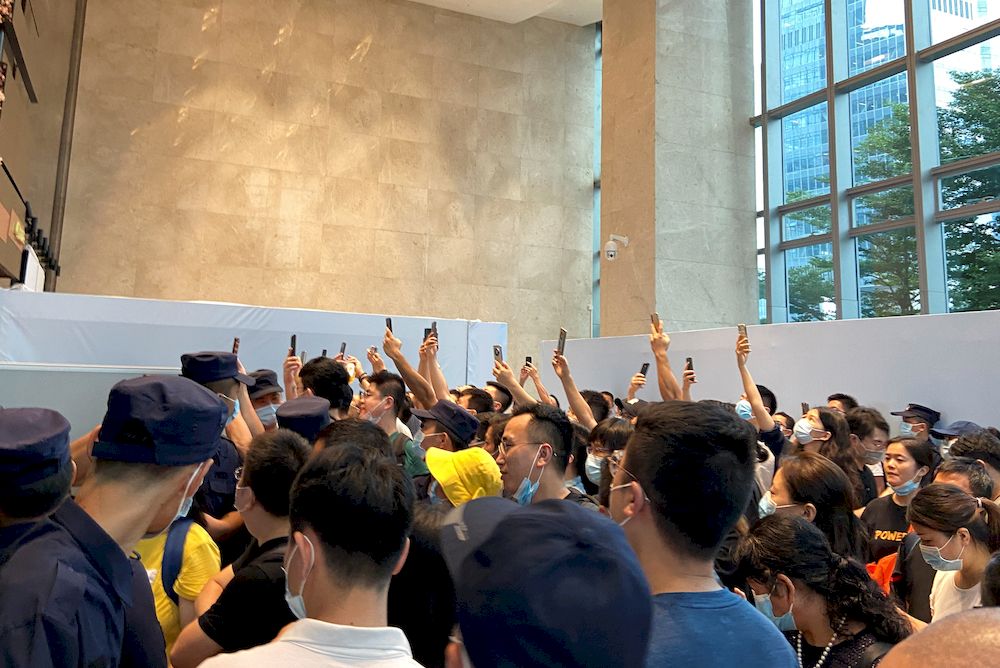 People gather to demand repayment of loans and financial products at the Evergrandeu00e2u20acu2122s headquarters, in Shenzhen, Guangdong province, China September 13, 2021. u00e2u20acu201d Reuters pic